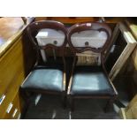 2 black seat mahogany dining chairs