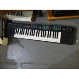 Boxed Yamaha Portaton PSR-22 electric keyboard with stand