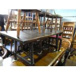 Large rectangular dining table on bobbined supports and cross stretcher and set of 6 chairs with red