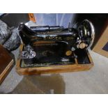 Cased singer sewing machine.