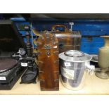 Two modern lidded tantalus together with metal and wicker wine rack etc.
