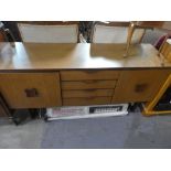 Vintage teak sideboard by Europa with 4 central drawers flanked with cupboards