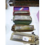 4 cased Harmonicas one being A/F