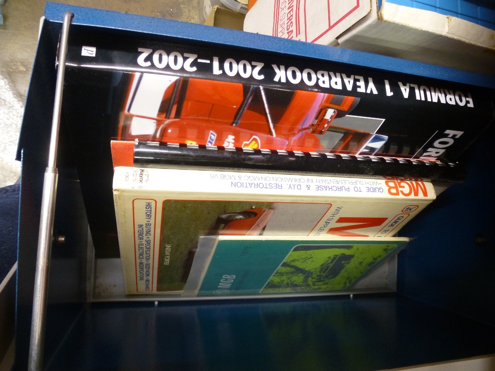 A quantity of books and magazines, some relating to motor industry topics. Together with an original