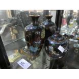 Oriental style brass enamelled vases and a lidded example.