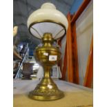 Brass and glass vintage oil lamp complete with shade and chimney.