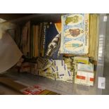 Quantity of tea card albums together with loose examples etc.