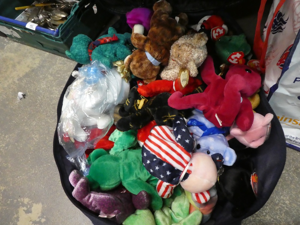 A suitcase of Ty Beanie babies and 6 in cases