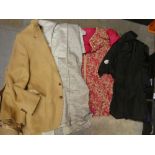 A wicker box of garments to include men’s jackets, Indian dress clothes, etc.