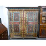 An 18th century painted European Armoire, dated 1786 and R I, probably Tyrolean, the cavetto moulded