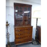 A Victorian mahogany secretaire chest with four drawers on turned feet with associated glazed top,