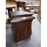 A Victorian rosewood lyre shaped cupboard having rising lid on bun feet, 35.5cms