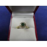 Emerald & Diamond cluster style ring on an 18ct yellow gold shank, stamped 750, size R/S, gross item