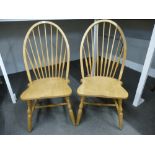 A pair of Slovenian stickback kitchen chairs with shaped seat