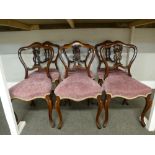 A set of six Victorian rosewood dining chairs on cabriole legs