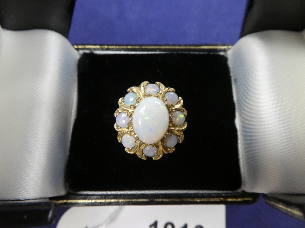 9ct yellow gold & opal cluster style dress ring, central opal surrounded by 8 small opals, shank