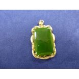 Rectangular green hard stone possibly jade pendant with an 18K yellow gold mount stamped 18K, 3.5