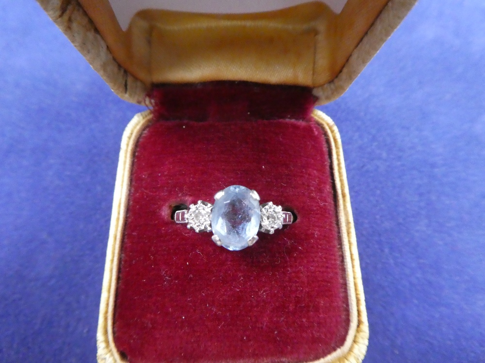 Aquamarine and white coloured ring on an 18ct yellow gold and platinum shank, stamped 18ct PLAT,