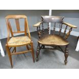 An old Elm and Beech Smoker's bow armchair, and a rush seated bedroom chair