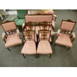 An Edwardian inlaid Rosewood Salon suite comprising settee with matching armchairs and a set of four