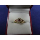 Pretty ruby and diamond ring on an 18ct yellow gold shank, stamped 18, size O, gross weight 3.8g