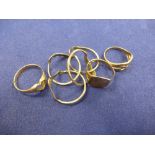 Four 9ct yellow gold rings including puzzle ring, Etc all stamped 375, total item weight 10.5g