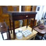 A Georgian mahogany triple top tea and card table on square chamfered legs, 83 cms