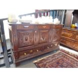 An antique oak mule chest having panelled decoration with two drawers on square legs. 134cms.