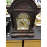 A late Victorian mahogany chiming mantle clock by Walke4r and Hall with letter wall bracket, no