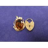 9ct yellow gold pendant set with an amber coloured stone, stamped 375, 2.75 cm long, together with a