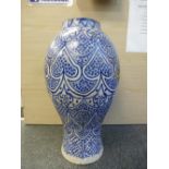 A large antique blue and white pottery vase, probably Moroccan, 62 cms