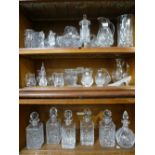 Six glass decanters and two shelves of sundry glassware