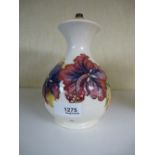 A Moorcroft baluster lamp decorated flowers, 17 cms