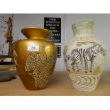 Two ornate jugs with animal decoration