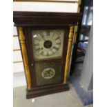 An American style wall clock by Seth Thomas with gilt column sides