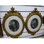 A pair of antique oval portrait engravings of figures in decorative gilt frames