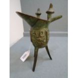 Small Chinese bronze ritual wine vessel on 3 splayed legs, 15cm high