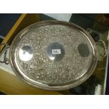 Oval white coloured metal double-handled tray with embossed decoration of figures, scrolling