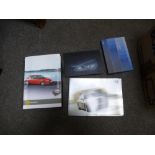 Two cartons of Car brochures presspacks, Bonhams catalogues and similar; mainly post 2000