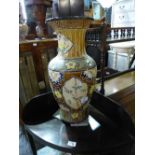 A large Oriental style vase decorated with flowers and bamboo