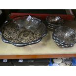 A pink glass fruit bowl and six dishes with silver overlaid decoration