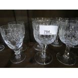 Large quantity of cut crystal drinking vessels including tumblers, wine glasses, champagne flutes