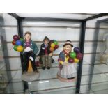 A Royal Doulton figure of Balloon Boy HN2934, Balloon Girl HN2818 and the Balloon Man HN1954