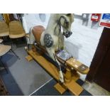 An antique rocking horse on painted pine base, probably late 19th early 20th century. Length of