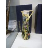 A Moorcroft Wild Meadow jug, designed by Emma Bossons, 18.5 cms, together with a Moorcroft Wild