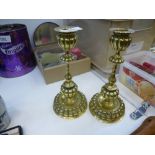 A pair of Victorian brass candlesticks with petal design, 20.5cms