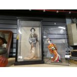 Two glazed display cases containing Geishas