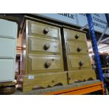 A pair of waxed pine bedside chests of 3 drawers