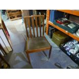 Set of four 1970's Teak dining chairs with brown seat pads