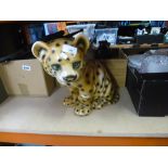 An old ceramic cheetah cub